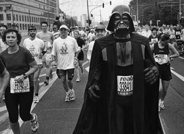 DEU, Germany, Berlin, 27.09.1999, A man wearing Dark Wader costume runs the Berlin Marathon