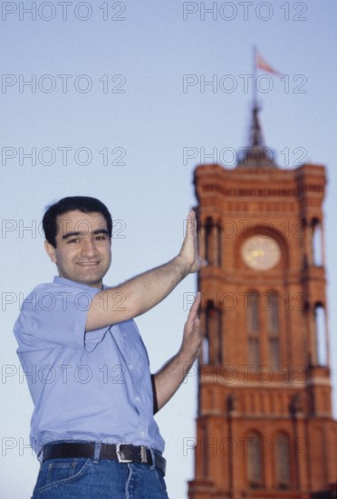 DEU Germany Germany Berlin Portrait of Özcan Mutlu, MdB (Alliance 90/The Greens) - Migration Policy Section, Member of the Federal Executive Committee of ImmiGrün e.V. and coordinator of Christian Ströbele's election campaign in front of the Red Town Hall