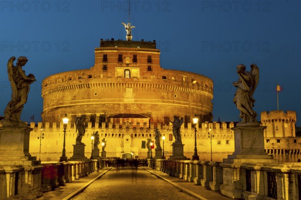 View of blue hour at nightfall in 139 AD as an ancient mausoleum Hadrian Tomb for Emperor Caesar Emperor Hadrian built Castel Sant'Angelo Sant'Angelo on the banks of the Tiber, in front of Ponte degli Angeli Angel Bridge with statues of winged beings angels, Rome, Lazio, Italy