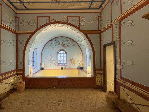 Reconstructed Roman ancient frigidarium cooling room refrigeration room with cold water basin under barrel vault in part of building with Roman baths Bath complex Thermal baths in Roman Villa Archaeological Park Roman Villa Borg, Perl, Saarland, Germany