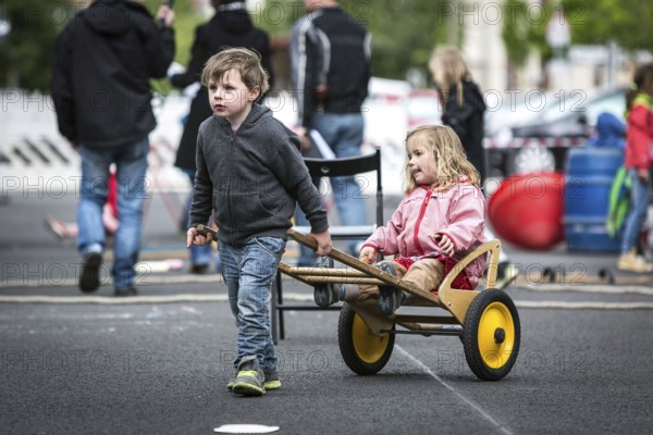 DEU Germany Germany Berlin Children play on Gudvanger Straße, which has been declared the city's first temporary play street. Parents, daycare and a school had worked to temporarily close the road on Oberen Prenzlauer Berg to road traffic