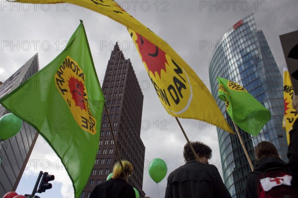 Germany Berlin Anti-nuclear power demonstration in Berlin Mitte. Demonstrators with flags in front of the start of the train. Germany Berlin protest rally against nuclear power plants. Protesters carry flags at the start up of the rally