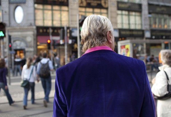 DEU Berlin tourist with purple jacket on Rosenthaler Straße in Berlin Mitte Germany Berlin Tourist with purple Balzer strolls along Rosenthaler Straße in Berlin Mitte