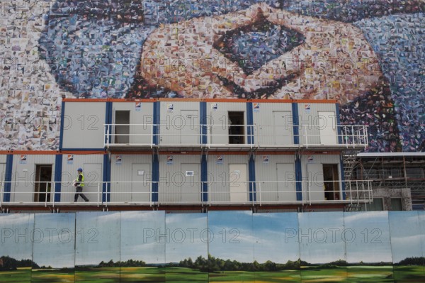 DEU Germany Germany Berlin large poster with Angela Merkel's hands, Merkel diamond, on a building near the main train station