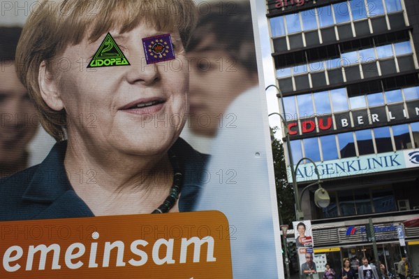 DEU Germany Germany Berlin Campaign poster by Federal Chancellor Angela Merkel near the CDU Berlin headquarters and an eye clinic