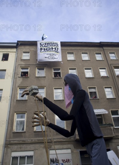 GERMANY Demonstrators march through Kreuzberg with a huge puppet during the May 1 rally. Germany Berlin Demonstrators with a Giant Puppet during the May Day Protest