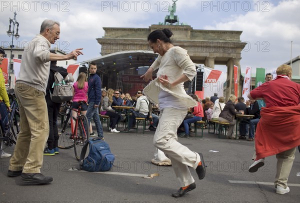 GERMANY Dancers at the DGB rally in front of the Brandenburg Gate Germany Berlin People dance in front of Brandenburg Gate during the May Day Protest of the German Unions