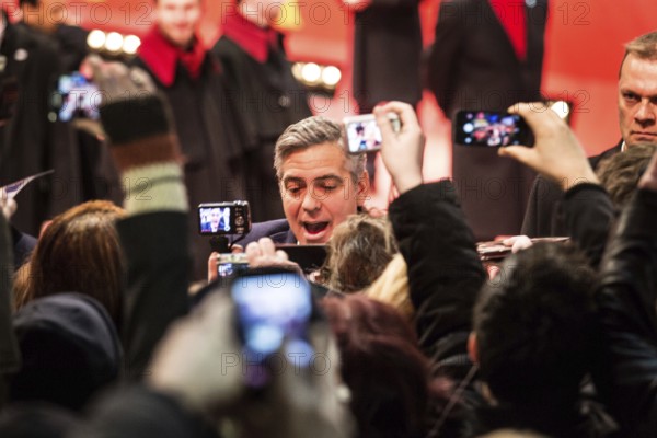 DEU Germany Germany Berlin 64th Berlinale, the international film festival in the German capital. The director of the films 'Monuments Men' George Clooney signs autographs