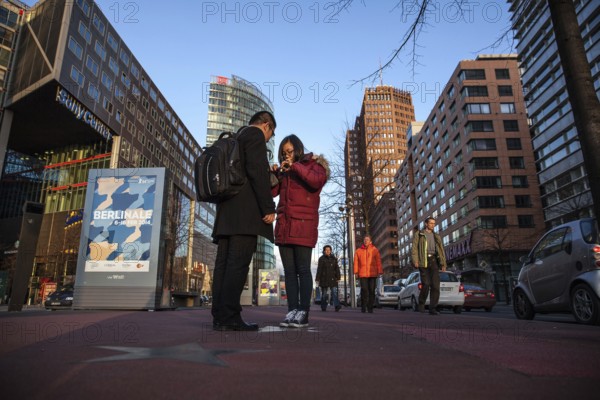 DEU Germany Germany Berlin 64th Berlinale, the international film festival in the German capital. Chinese tourists take pictures of the Boulevard of Stars