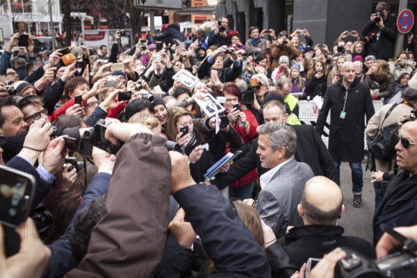 DEU Germany Germany Berlin 64th Berlinale, the international film festival in the German capital. The director of the films 'Monuments Men' George Clooney signs autographs