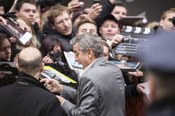 DEU Germany Germany Berlin 64th Berlinale, the international film festival in the German capital. The director of the films 'Monuments Men' George Clooney signs autographs