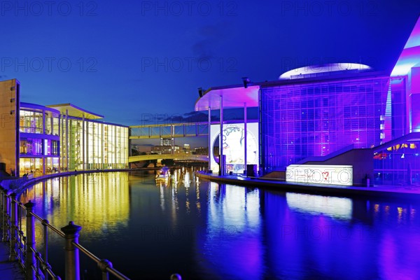 Illuminated Paul Löbe House and Marie Elisabeth Lüders House with the Spree River in the evening, government district, Berlin-Mitte, Berlin, Germany