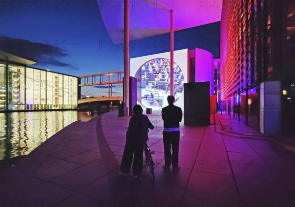 Open-air cinema on German history at Marie-Elisabeth-Lüders-Haus with the river Spree in the evening, government district, Berlin-Mitte, Berlin, Germany