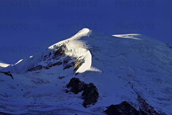 Snow-capped Dome du Goûter, Chamonix-Mont-Blanc, Haute-Savoie, France