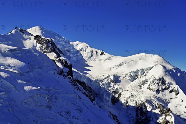 Mont Maudit covered with snow from the left, Mont-Blanc, Dôme du Goûter, Aiguille du Midi mountain station viewing platform, Chamonix-Mont-Blanc, Haute-Savoie, France