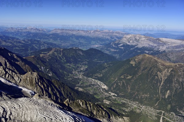 View from the Aiguille du Midi mountain station observation deck into the valley with the city, Chamonix-Mont-Blanc, Haute-Savoie, France