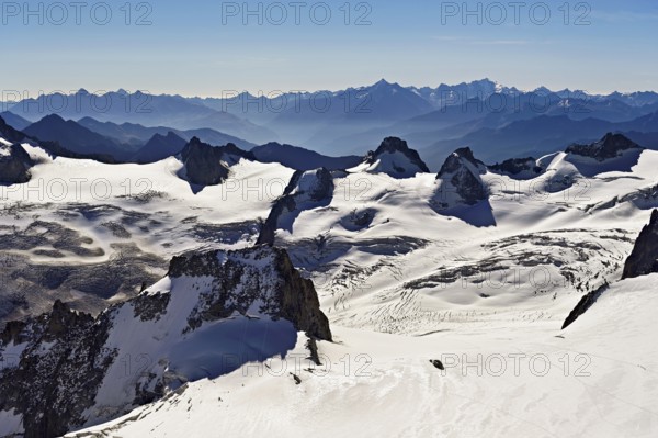 View of the snow-capped mountains from the Aiguille du Midi mountain station observation deck, Chamonix-Mont-Blanc, Haute-Savoie, France
