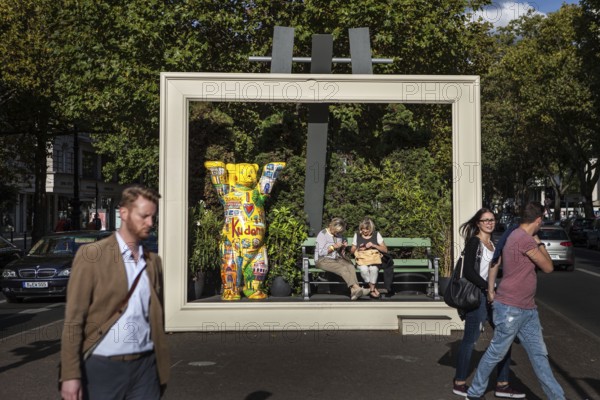 DEU Germany Germany Berlin Passers-by pass by an oversized picture frame with a Berlin bear on the Kudamm