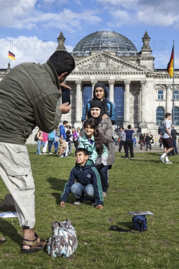 DEU Germany Germany Berlin Tourists take pictures of themselves in front of the Reichstag
