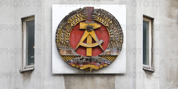 Old building of the Wall Museum — Museum Haus am Checkpoint Charlie with old GDR coat of arms, Friedrichstraße, Kreuzberg, Berlin, Germany
