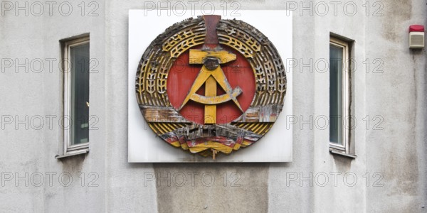 Old building of the Wall Museum — Museum Haus am Checkpoint Charlie with old GDR coat of arms, Friedrichstraße, Kreuzberg, Berlin, Germany