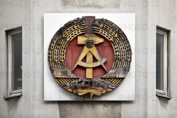 Old building of the Wall Museum — Museum Haus am Checkpoint Charlie with old GDR coat of arms, Friedrichstraße, Kreuzberg, Berlin, Germany