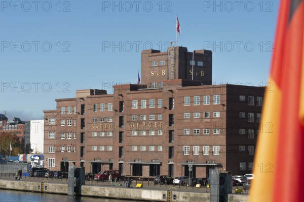 Harbor, Baltic Sea, Kiel Fjord, shipping traffic, wharf, pier, Sartori Berger Speicher, red brick building, architecture, Germany flag, sunshine, blue sky, Schleswig-Holstein, Germany