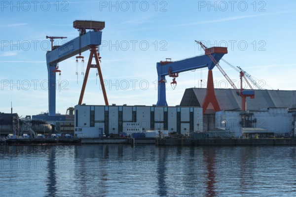 German Naval Yards, shipyard, warehouses, cranes, harbor, Baltic Sea, Kiel Fjord, shipping traffic, sunshine, blue sky, Schleswig-Holstein, Germany