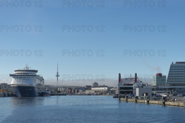 Harbor, Baltic Sea, city view Kiel, Kiel Fjord, color line, ferry to Oslo, shipping, cruise ship, Stena Scandinavica ferry on the pier, Swedish wharf, telecommunications tower or television tower, architecture, haze layer, sunshine, blue sky, Schleswig-Holstein, Germany