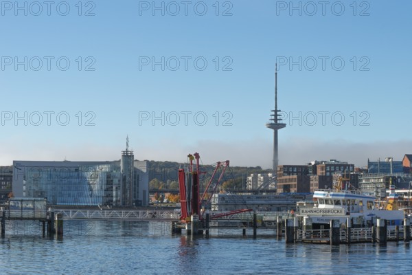 Harbor, Baltic Sea, city view Kiel, Kiel Fjord, shipping traffic, regular ferry service, Hörn bridge, folding bridge, architecture, glass Hörn, telecommunications tower or television tower, sunshine, blue sky, Schleswig-Holstein, Germany
