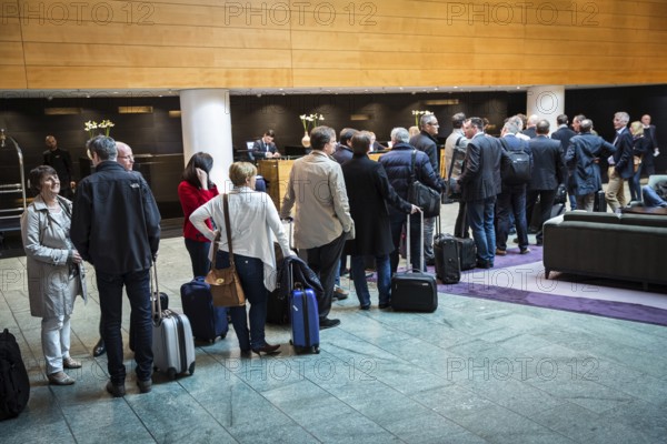 DEU Germany Germany Berlin manager meeting at the Hyatt Hotel in Berlin. Front desk attendees in front of check-in