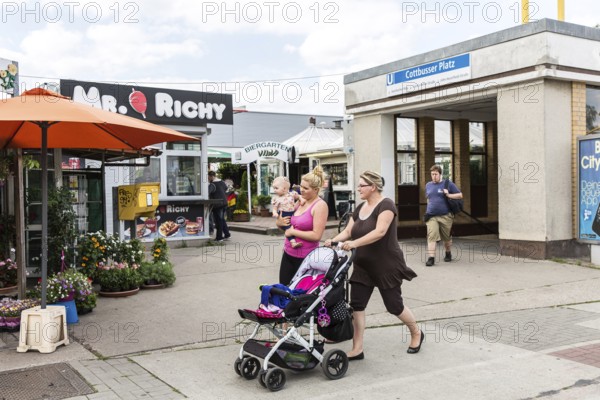 DEU Germany Germany Berlin Living in Berlin-Hellersdorf. Viwa stalls and beer garden in front of a supermarket