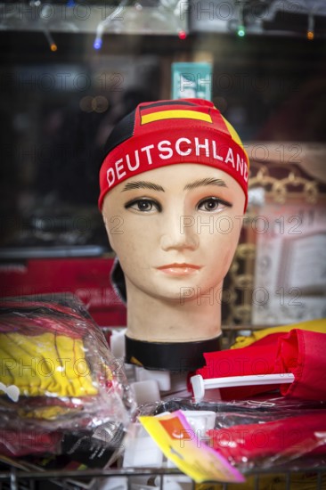 DEU Germany Germany Berlin doll with euro 2016 fan item in a shop window in Neukölln