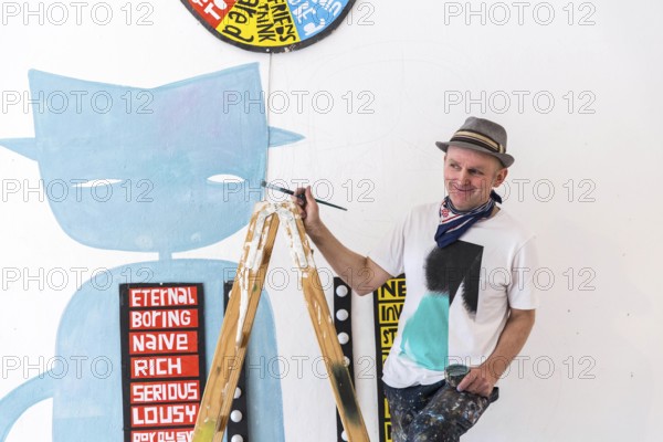 DEU Germany Germany Berlin The artist Jim Avignon setting up an exhibition at the 'Retram' gallery in Berlin-Neukölln