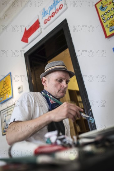 DEU Germany Germany Berlin The artist Jim Avignon setting up an exhibition at the 'Retram' gallery in Berlin-Neukölln
