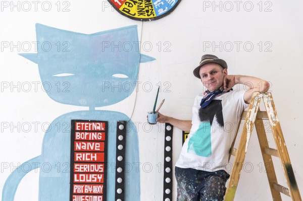 DEU Germany Germany Berlin The artist Jim Avignon setting up an exhibition at the 'Retram' gallery in Berlin-Neukölln