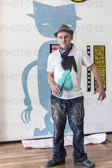 DEU Germany Germany Berlin The artist Jim Avignon setting up an exhibition at the 'Retram' gallery in Berlin-Neukölln