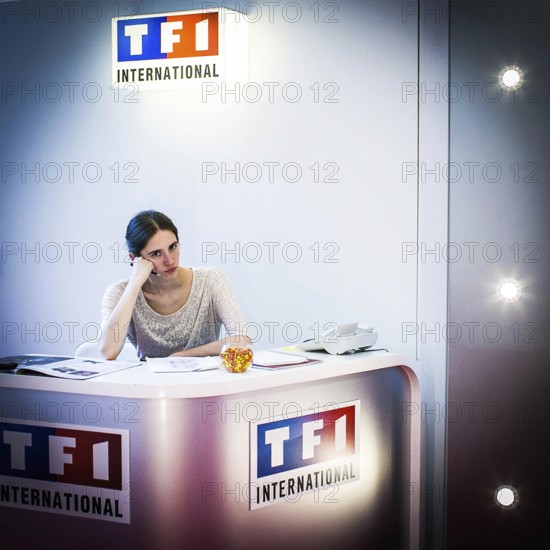 DEU Germany Germany Berlin 65th Berlinale, the international film festival in the German capital. An employee at the French TV channel TV1 stand at the European Fim Market