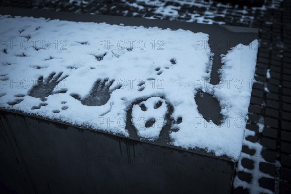 DEU Germany Germany Berlin Messages immortalized in snow from visitors to the Holocaust Memorial in Berlin-Mitte