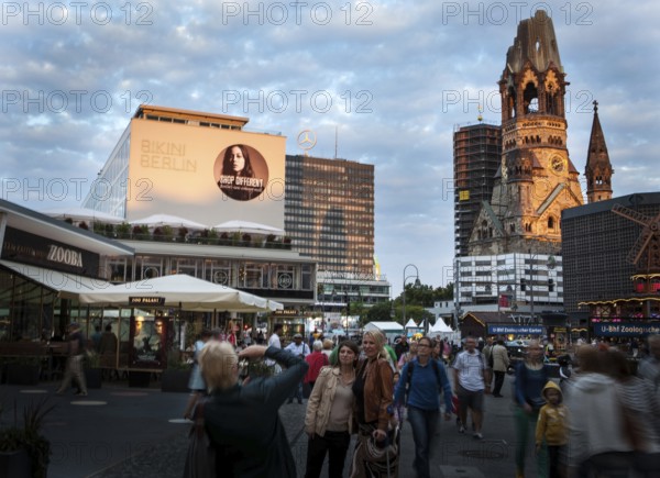DEU Germany Germany Berlin The new bikini house and memorial church are illuminated by warm evening light