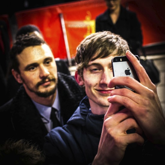 DEU Germany Germany Berlin 65th Berlinale, the international film festival in the German capital. James Franco with selfie-making fan on the red carpet for the Wenders film 'Everything will be fine'