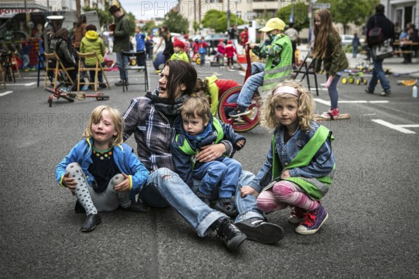 DEU Germany Germany Berlin Children play on Gudvanger Straße, which has been declared the city's first temporary play street. Parents, daycare and a school had worked to temporarily close the road on Oberen Prenzlauer Berg to road traffic
