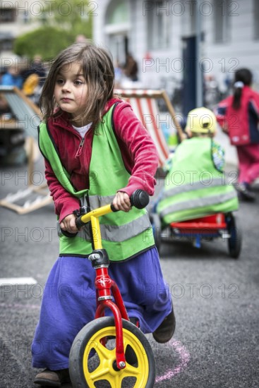 DEU Germany Germany Berlin Children play on Gudvanger Straße, which has been declared the city's first temporary play street. Parents, daycare and a school had worked to temporarily close the road on Oberen Prenzlauer Berg to road traffic