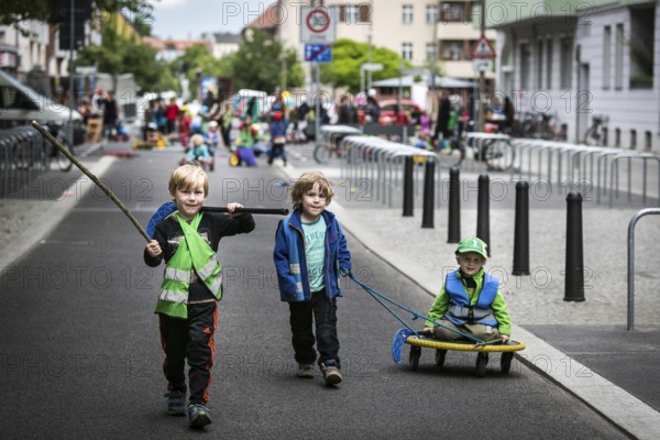 DEU Germany Germany Berlin Children play on Gudvanger Straße, which has been declared the city's first temporary play street. Parents, daycare and a school had worked to temporarily close the road on Oberen Prenzlauer Berg to road traffic