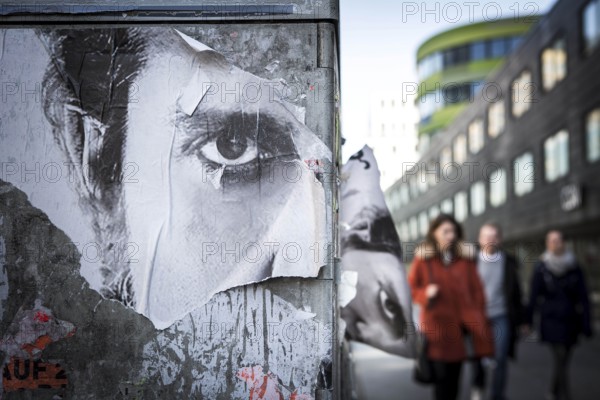 DEU Germany Germany Berlin poster with the eyes of a man's face on Rudi-Dutschke-Str