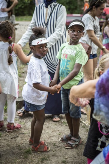 DEU Germany Germany Berlin Summer party at the Northwest daycare center on Prager Platz. African siblings dancing