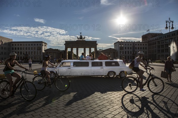 DEU Germany Germany Berlin A stretch trot, an extended version of the former East Trabant car, stands with guests on Pariser Platz in front of the Brandenburg Gate