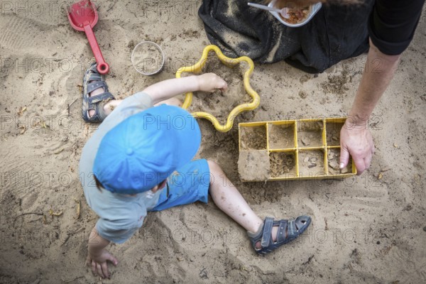 DEU Germany Germany Berlin Summer party at the Northwest daycare center on Prager Platz. Sandbox game
