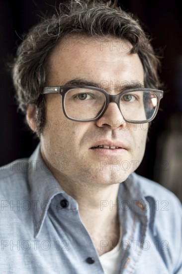 DEU Germany Germany Berlin The writer Phillip Schönthaler during a portrait appointment at the Morena Cafe in Kreuzberg