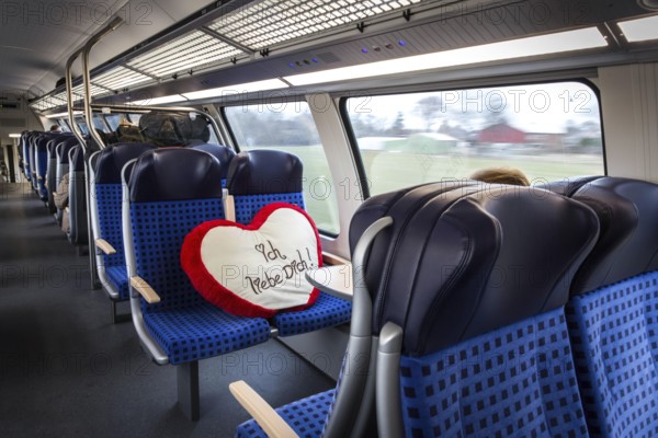 DEU Germany Germany Flensburg A pillow with the words “I love you” is on the seat of a regional train from Hamburg to Flensburg